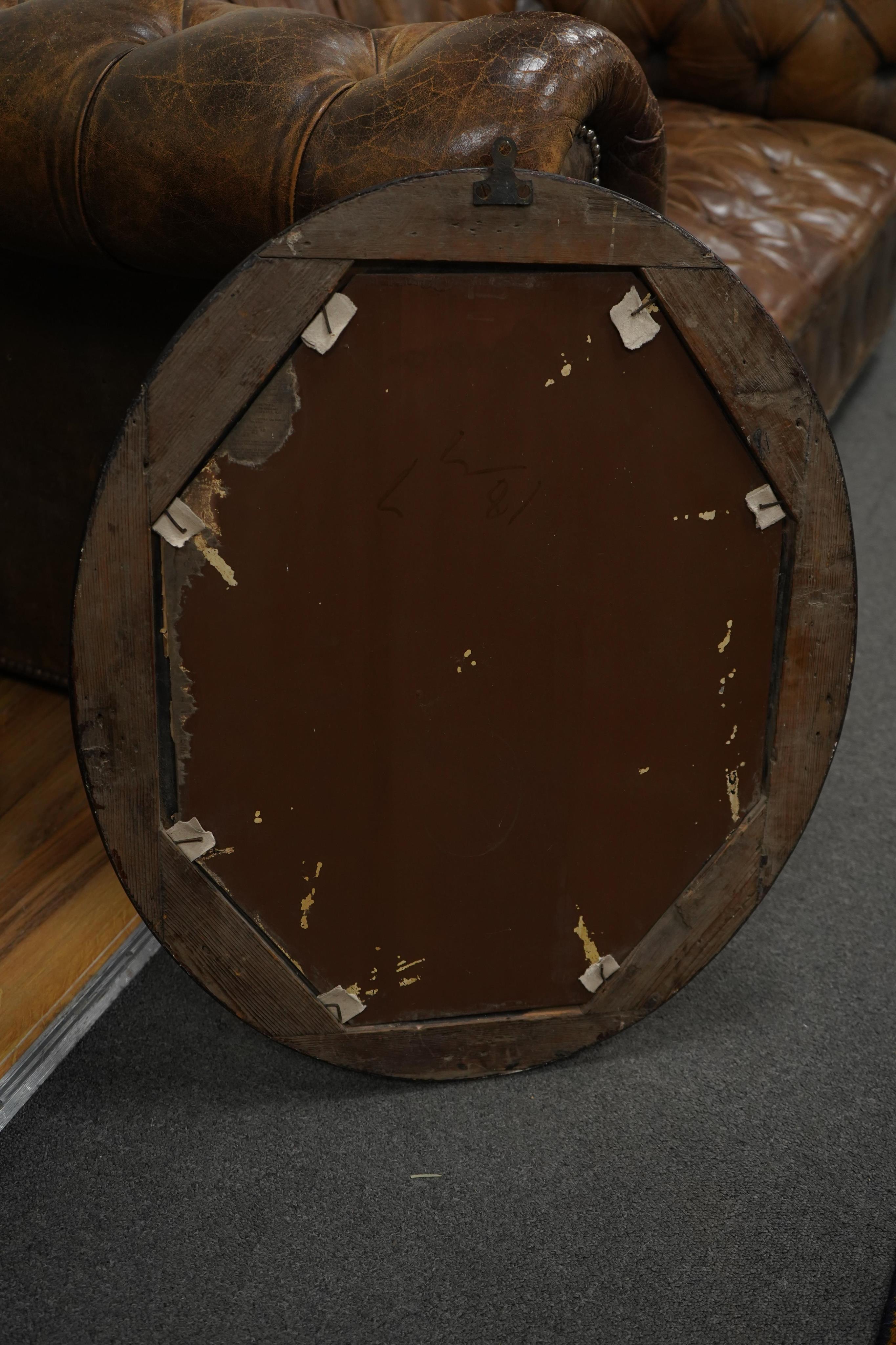 A 19th century oval Irish wall mirror, width 54cm, height 62cm. Condition - fair